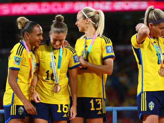 Sweden players celebrate with their bronze medals after winning the Australia and New Zealand 2023 Women's World Cup third place play-off football match between Sweden and Australia