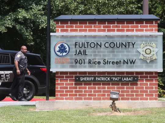 An officer guards the entrance to the Fulton County Jail in Atlanta, Georgia. 