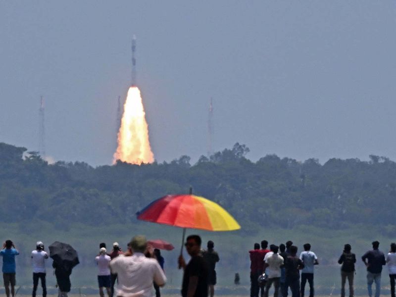 People watch as the PSLV XL rocket carrying the Aditya-L1 spacecraft