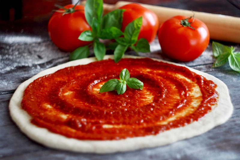 Adding extra ingredients to the tomato sauce takes away from the authenticity of Italian pizza