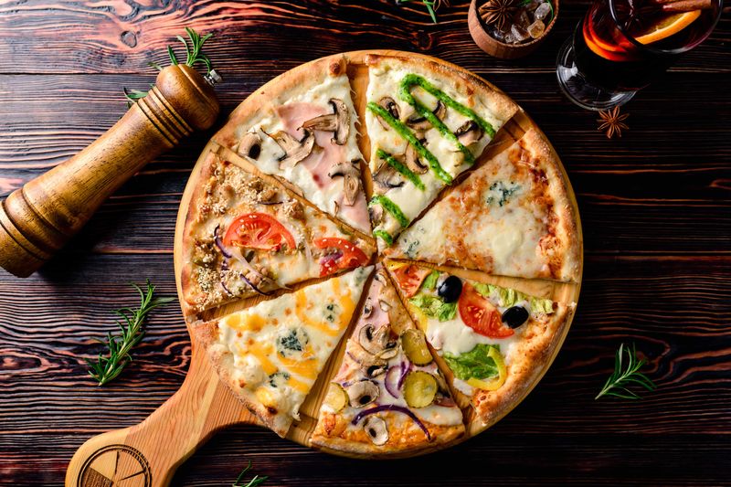 American pizzas usually have thicker crusts, generous toppings, including meat, vegetables, and a variety of cheeses