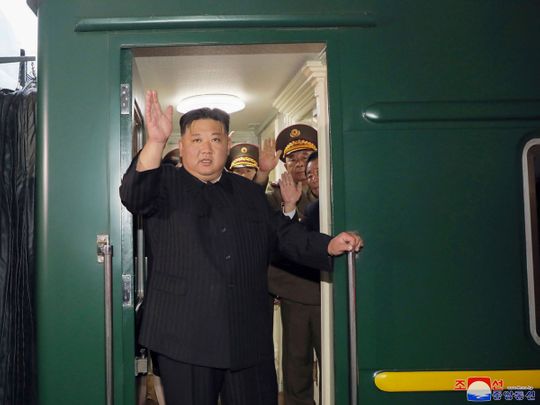 This Sept. 10, 2023 photo provided by the North Korean government shows that North Korea leader Kim Jong Un waves from a train in Pyongyang, North Korea, as he leaves for Russia. 