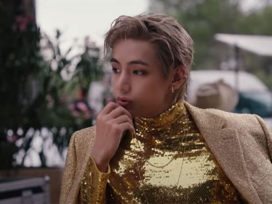 BTS’ V is dressed in sparkly gold outfit in ‘For Us’ music video.