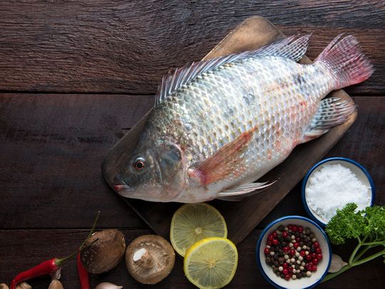 How did a woman lose all limbs after eating contaminated fish in