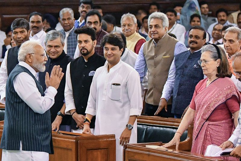 Prime Minister Narendra Modi greets Congress Parliamentary Party (CPP) Chairperson Sonia Gandhi at the Central Hall of the old Parliament building ahead of the Parliament Special Session, as Union Ministers Anurag Thakur, Jyotiraditya Scindia, Ashwini Vaishnaw and other Parliamentarians look on, in New Delhi on Tuesday.