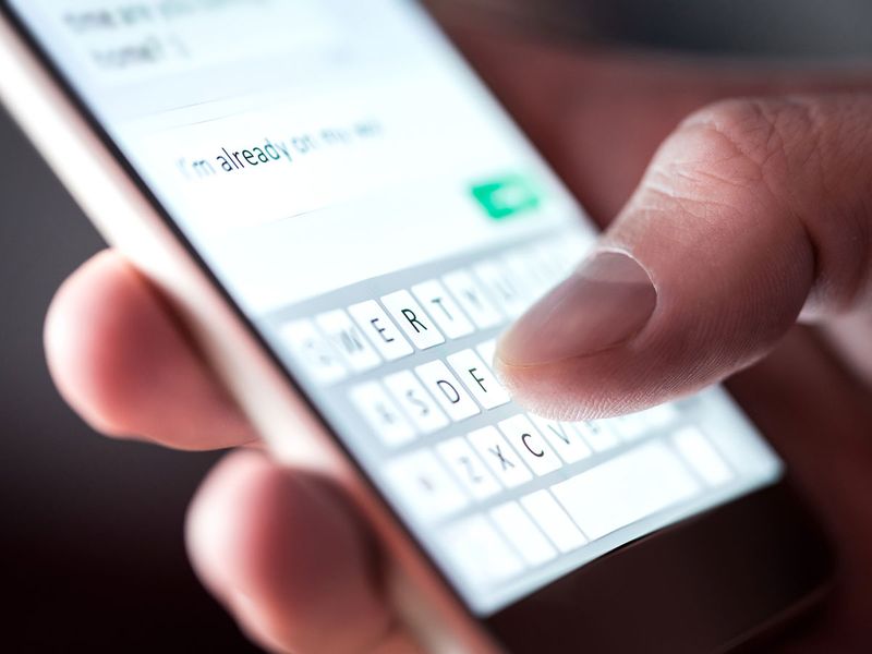 STOCK sending text message on mobile phone