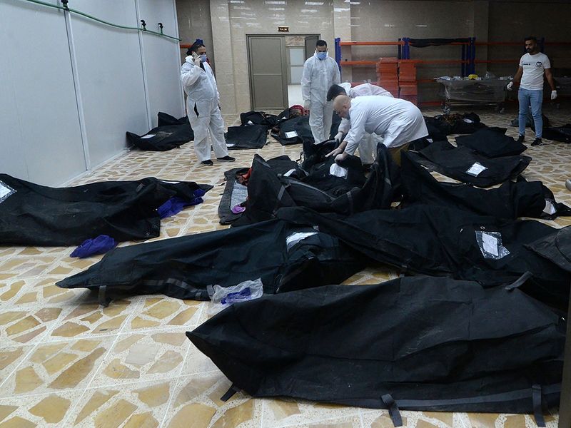 Bodies of people killed in a fire during a wedding in an event hall in Qaraqosh