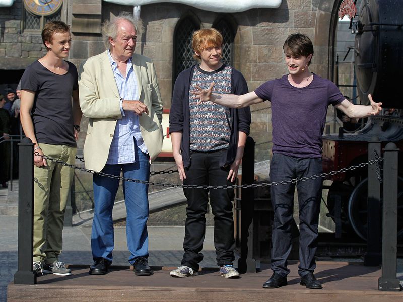FILE - Members of the cast of the Harry Potter films, from left, Tom Felton, Michael Gambon, Rupert Grint, and Daniel Radcliffe during grand opening ceremonies of the Wizarding World of Harry Potter at Universal Orlando theme park in Orlando, Florida, Friday, June 18, 2010. Actor Michael Gambon, who played Dumbledore in the later Harry Potter films, has died at age 82, his publicist says