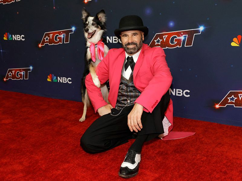 Winners of AGT Season 18 Adrian Stoica and Hurricane pose on the Red Carpet for 