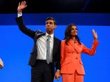 British Prime Minister Rishi Sunak and his wife Akshata Murty greet people on stage, at Britain's Conservative Party's annual conference in Manchester, Britain, October 4, 2023.