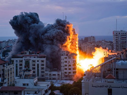 Fire and smoke rise following an Israeli airstrike, in Gaza City