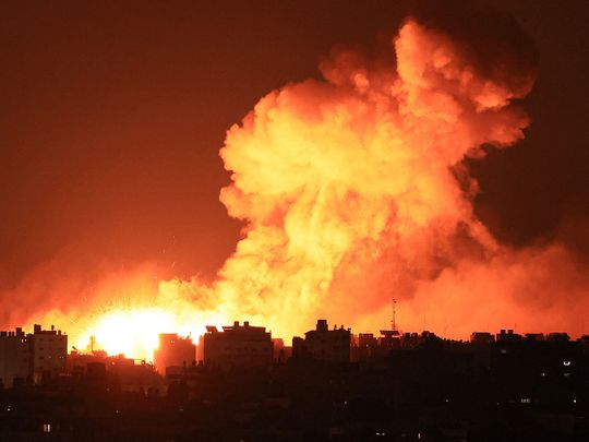 Explosions illuminate the sky during Israeli strikes on Gaza City