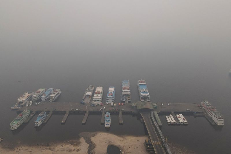 Smoke from wildfires in the Amazon is seen in the port of Manaus, Brazil October 12, 2023.