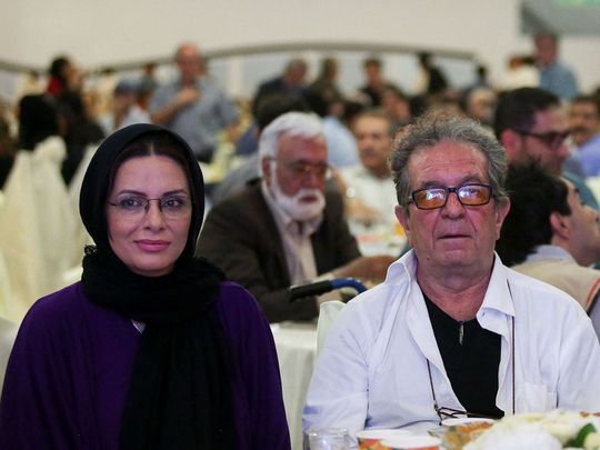 Iranian film director Dariush Mehrjui and his wife Vahida Mohammadifar attend a ceremony in Tehran on July 1, 2015.