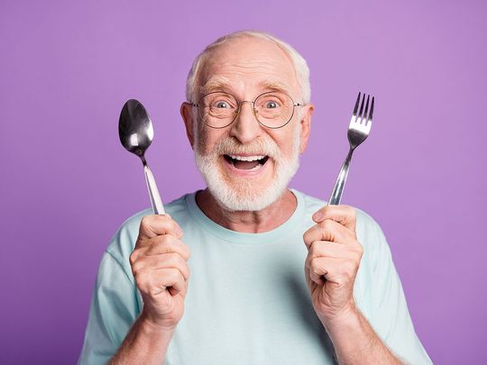 STOCK old man eating happy smiling