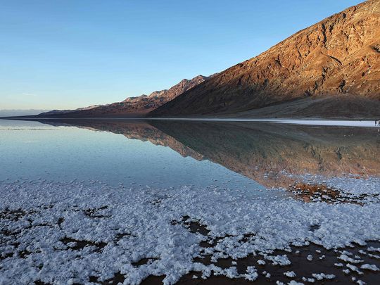 Photos: Sprawling lake greets visitors as Death Valley park reopens ...