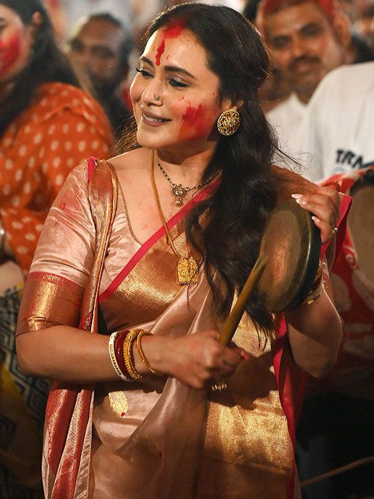 Bollywood actress Rani Mukerji plays an instrument on the last day of the 'North Bombay Sarbojanin Durga Puja' festival in Mumbai on October 24, 2023. 