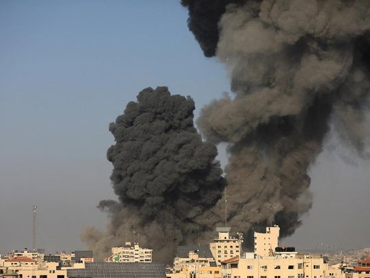 Smoke billows following an Israeli strike, in Gaza City