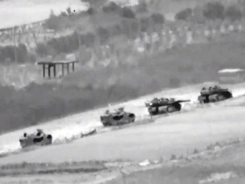 In this undated image taken from video released by Israeli Defense Forces, a line of Israeli tanks are shown during an incursion into the Gaza Strip.  