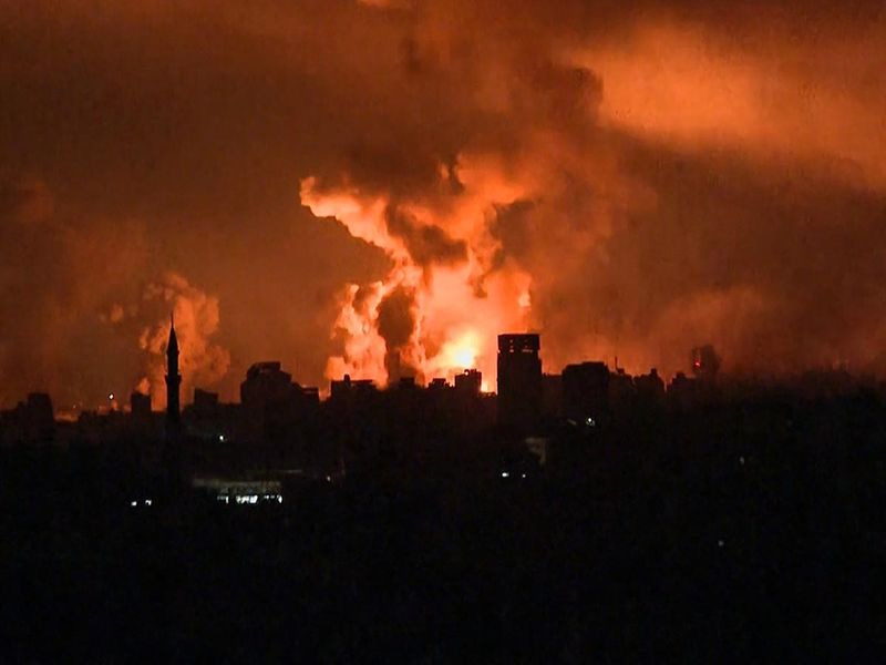 This image grab from an AFP TV footage shows balls of fire rising above Gaza City during an Israeli strike on October 27, 2023, as battles between Israel and the Hamas militants continue. 