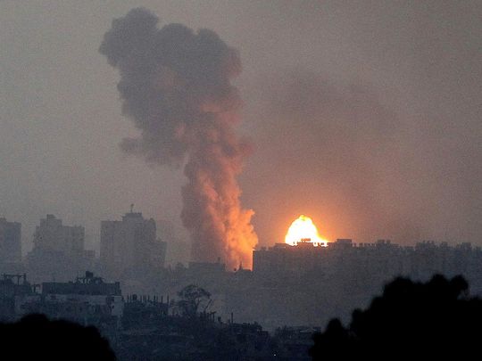 Fire and smoke rise following an Israeli airstrike in the Gaza Strip
