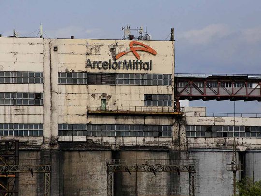 The logo of ArcelorMittal, a Western steel giant which entered the Kazakh market after the Soviet collapse, is seen on a mine building in the industrial town of Shakhtinsk on September 9, 2023.