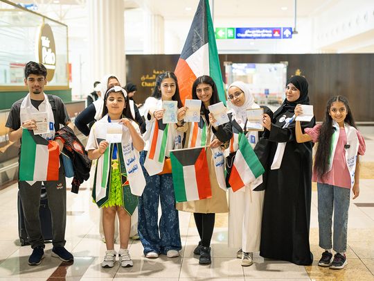 Arab Reading Challenge contestants showing special ARC stamps in passport on arrival at DXB