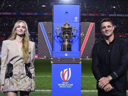 Sophie Turner and Dan Carter present the Webb Ellis Cup in the Louis Vuitton  Trophy Trunk