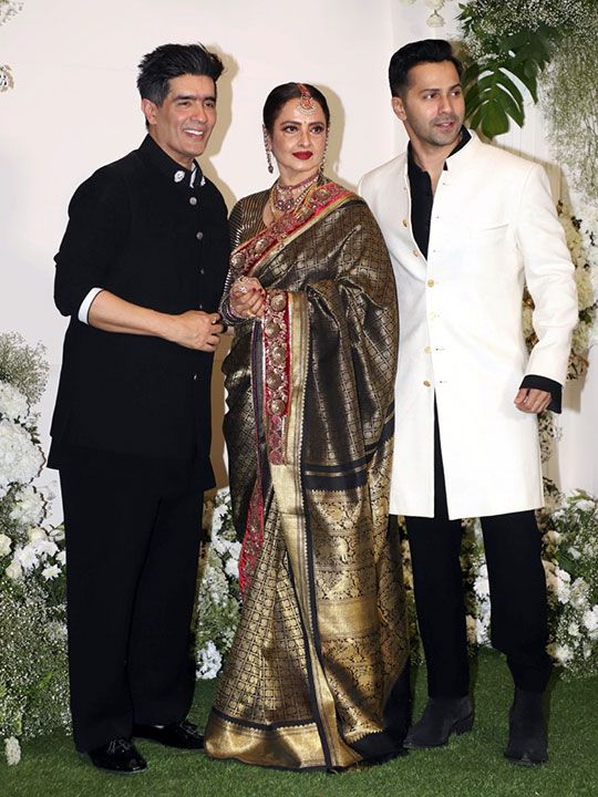 Fashion designer Manish Malhotra with actors Rekha and Varun Dhawan during Diwali celebrations in Mumbai on Sunday, November 05, 2023. (Photo: IANS)