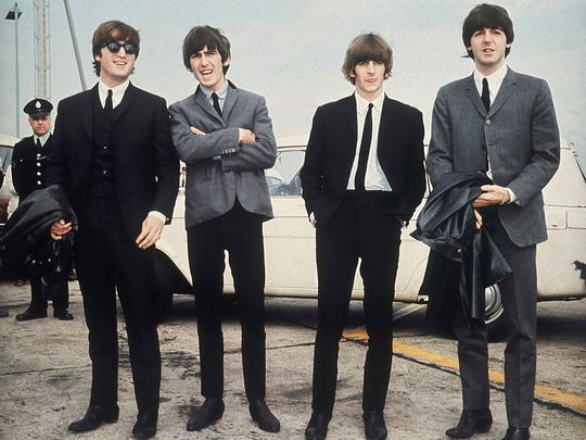 The Beatles, from left, John Lennon, George Harrison, Ringo Starr and Paul McCartney arrive in Liverpool, England on July 10, 1964, for the premiere of their movie 
