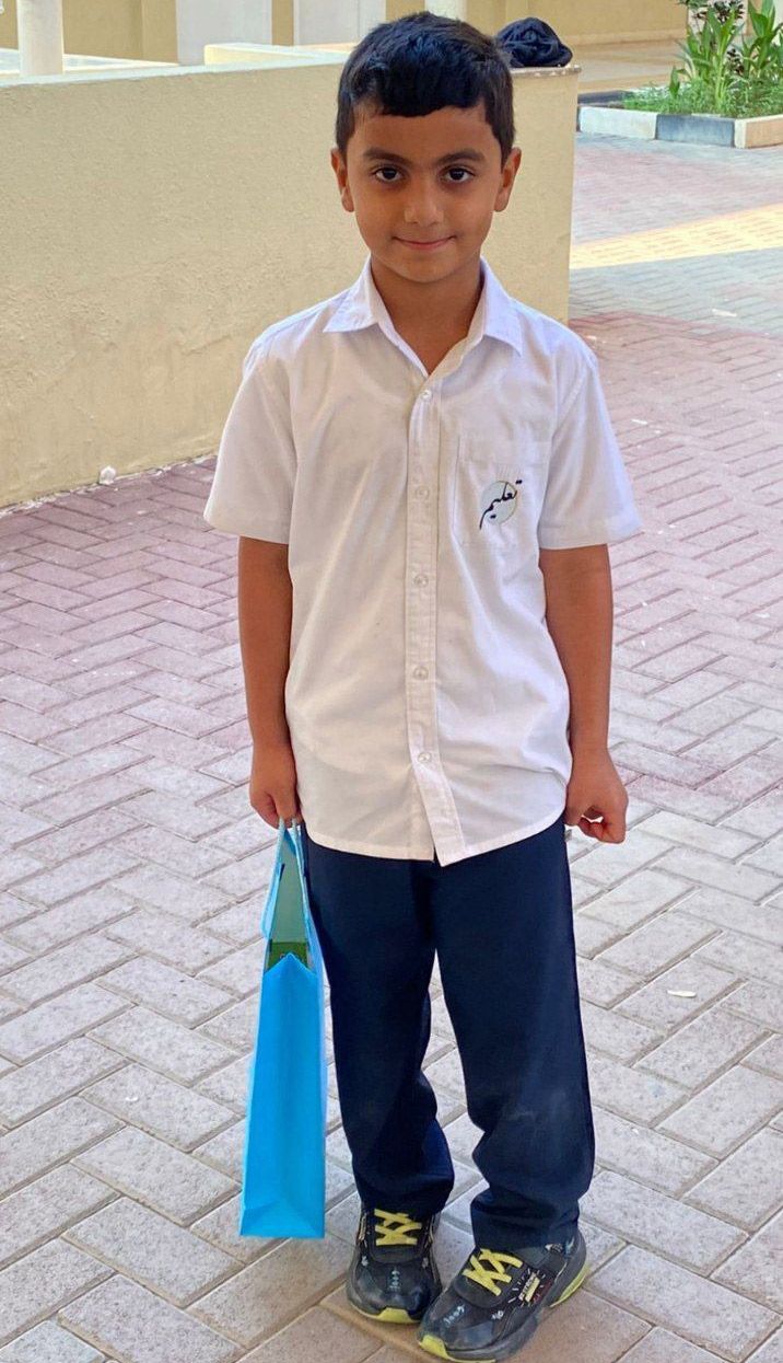 Ali in school uniform