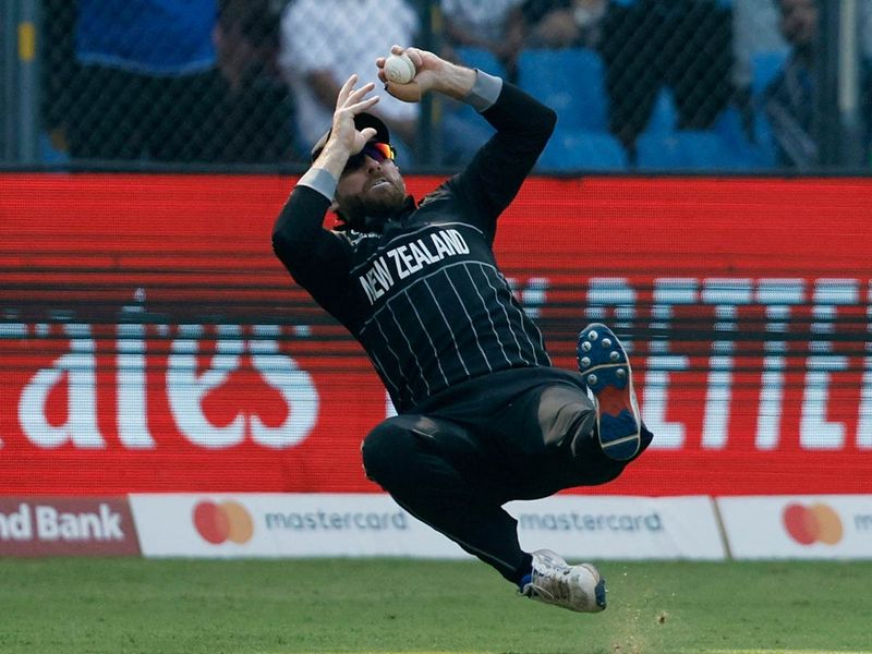 Kane Williamson takes the catch to dismiss India's Rohit Sharma