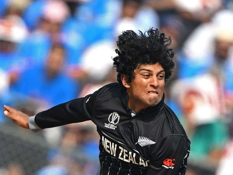 New Zealand's Rachin Ravindra bowls during the 2023 ICC Men's Cricket World Cup one-day international (ODI) first semi-final match between India and New Zealand at the Wankhede Stadium in Mumbai on November 15, 2023.