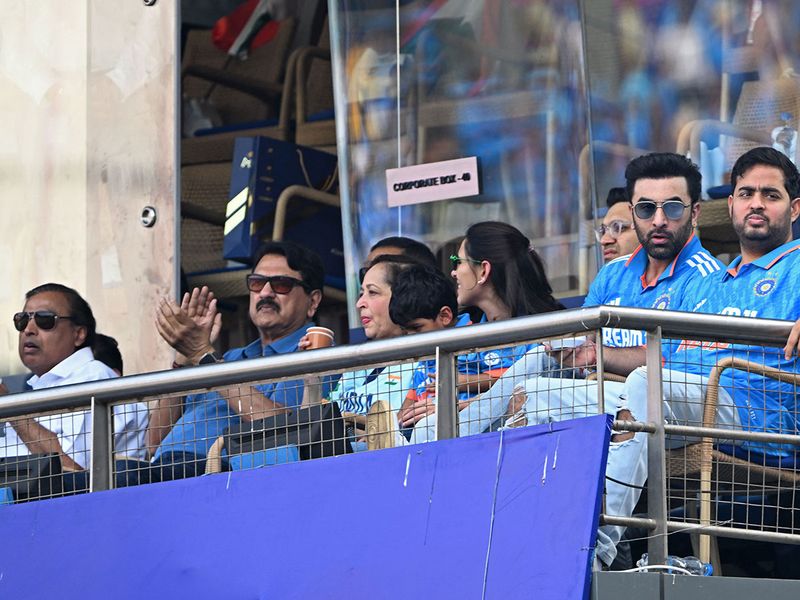 Reliance Industries billionaire Mukesh Ambani (L), his son Akash Ambani (R) and Bollywood actor Ranbir Kapoor (2R) watch the match.