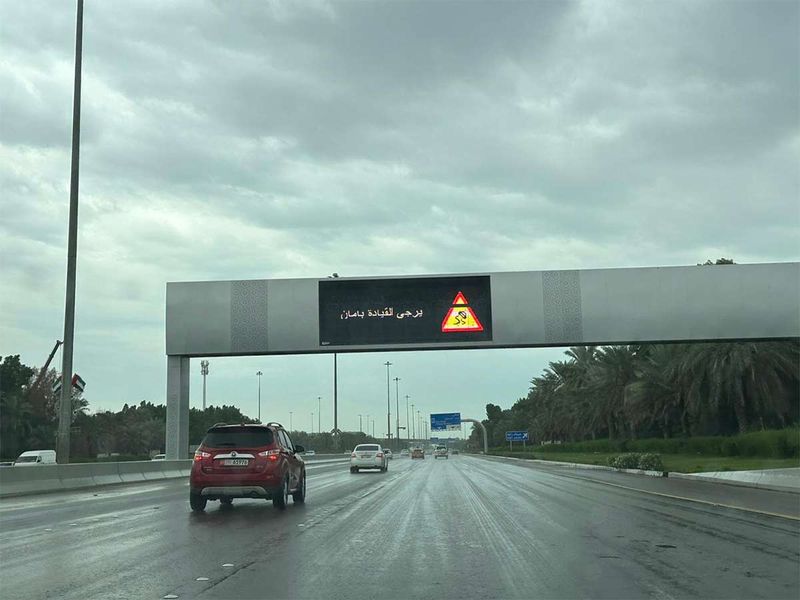 A traffic warning is seen displayed as vehicles pass through a section of a road in Abu Dhabi on Friday. 