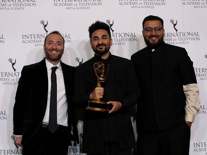 Writer, Director and Executive Producer Vir Das and Executive Producer Reg Tigerman pose with the Best Comedy award for 