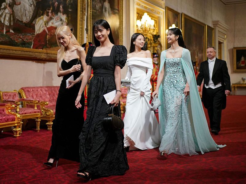 Members of South Korean girl band Blackpink  arrive for a State Banquet at Buckingham Palace in central London on November 21, 2023, for South Korea's President Yoon Suk Yeol and his wife Kim Keon Hee on their first day of a three-day state visit to the UK. South Korean President Yoon Suk Yeol and First Lady Kim Keon Hee began a three-day trip to the UK on Tuesday, with King Charles III's hosting his first state visitors since his coronation. (Photo by Yui Mok / POOL / AFP)