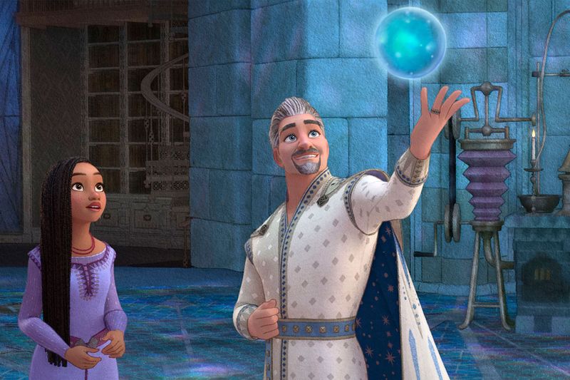 This image released by Disney shows Asha, voiced by Ariana DeBose, left, and King Magnifico, voiced by Chris Pine, in a scene from the animated film 