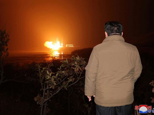 North Korean leader Kim Jong Un looks on as a rocket carrying a spy satellite Malligyong-1 is launched, as North Korean government claims, in a location given as North Gyeongsang Province, North Korea in this handout picture obtained by Reuters on November 21, 2023. 