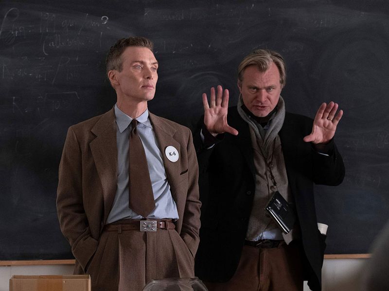 This image released by Universal Pictures shows writer-director-producer Christopher Nolan, right, and actor Cillian Murphy on the set of 