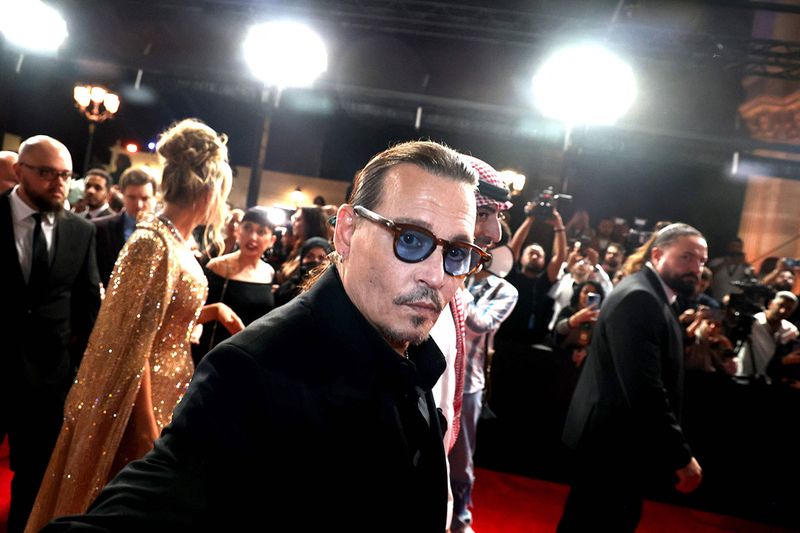 In this handout photo released by the Red Sea International Film Festival (RSFF), US actor Johnny Depp arrives for the opening of the RSFF festival in Jeddah on November 30, 2023. (Photo by PATRICK BAZ / Red Sea Film Festival / AFP) / RESTRICTED TO EDITORIAL USE - MANDATORY CREDIT 