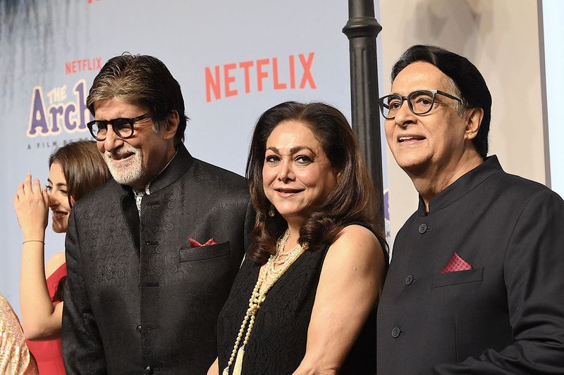 Bollywood actor Amitabh Bachchan (L) with his brother Ajitabh Bachchan (R) and actress Tina Ambani (C) attend the premiere of  Netflix's Indian Hindi-Language teen musical comedy film ‘The Archies’ in Mumbai on December 5, 2023. (Photo by SUJIT JAISWAL / AFP)