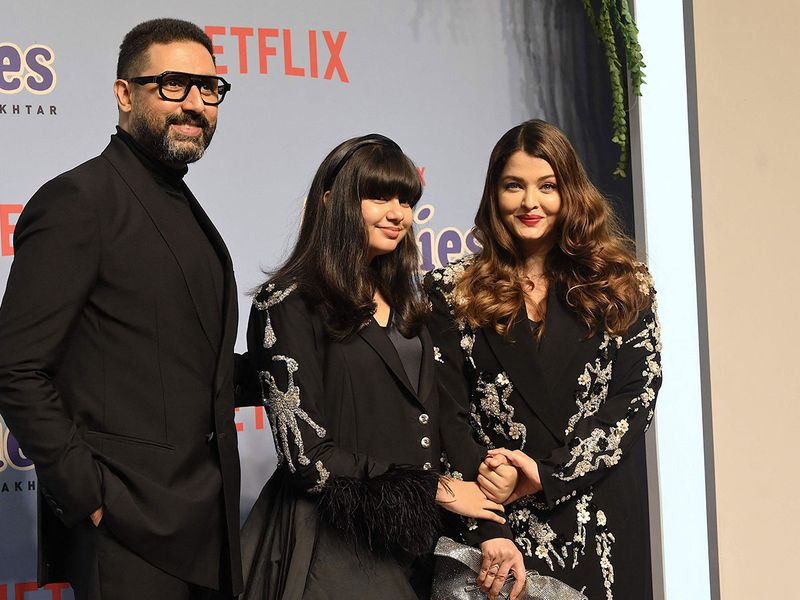 Bollywood actors Abhishek Bachchan (L) and Aishwarya Rai Bachchan (R) with daughter Aradhya (C) attend the premiere of Netflix's Indian Hindi-Language teen musical comedy film ‘The Archies’ in Mumbai on December 5, 2023. (Photo by SUJIT JAISWAL / AFP)