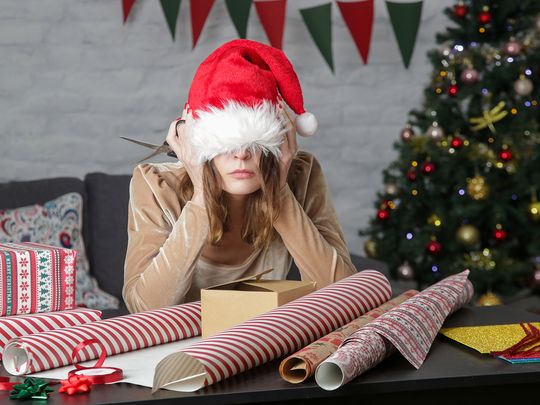 Person sitting with Christmas cap
