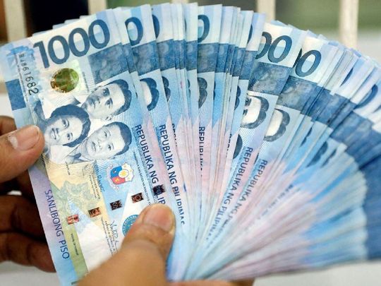 Philippine peso bills inside a money changer in metro Manila