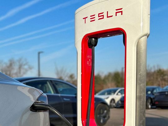 FILE PHOTO: Tesla Supercharger station at a Tesla store in Ann Arbor, Michigan, U.S., December 7, 2023.  REUTERS/Paul Lienert/File Photo
