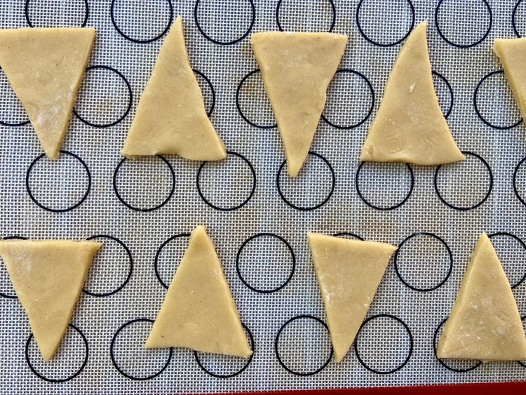 Cut dough into tree-shaped triangles, place on lined tray with 2-inch space & bake for 18-20 mins.