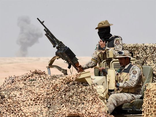 Special forces look on during military exercises in Hafar Al Batin, Saudi Arabia.