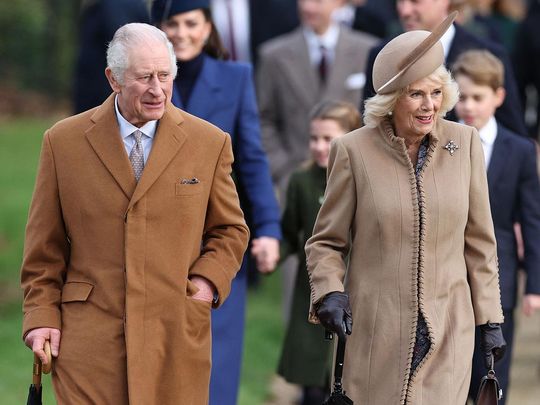 Britain's King Charles III (L) and Britain's Queen Camilla (R) 