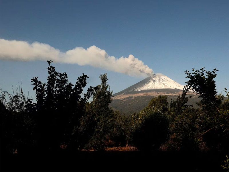 Steam and ashes emerge from the Popocatepetl volcano as seen from the town of Santiago Xalizintla, Mexico, May 12.